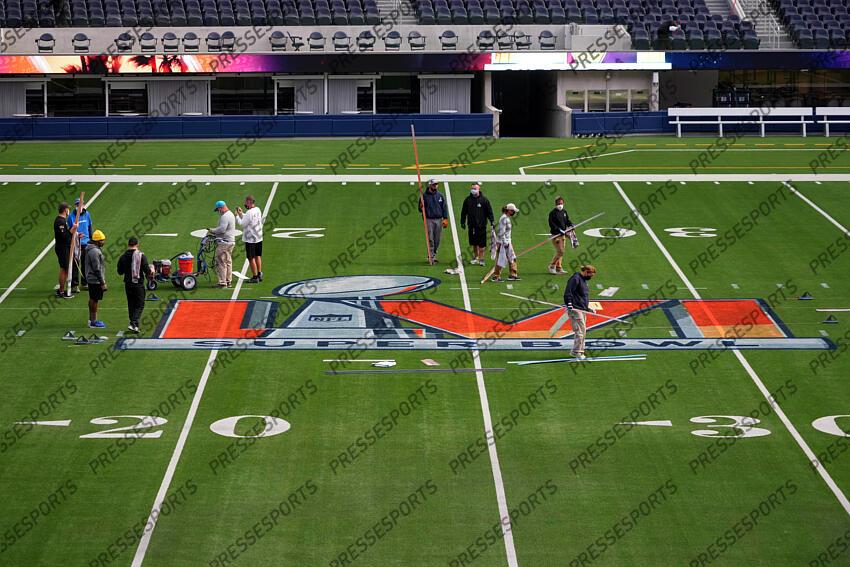 01 February 2022, US, Inglewood: Workers paint the Super Bowl LVI